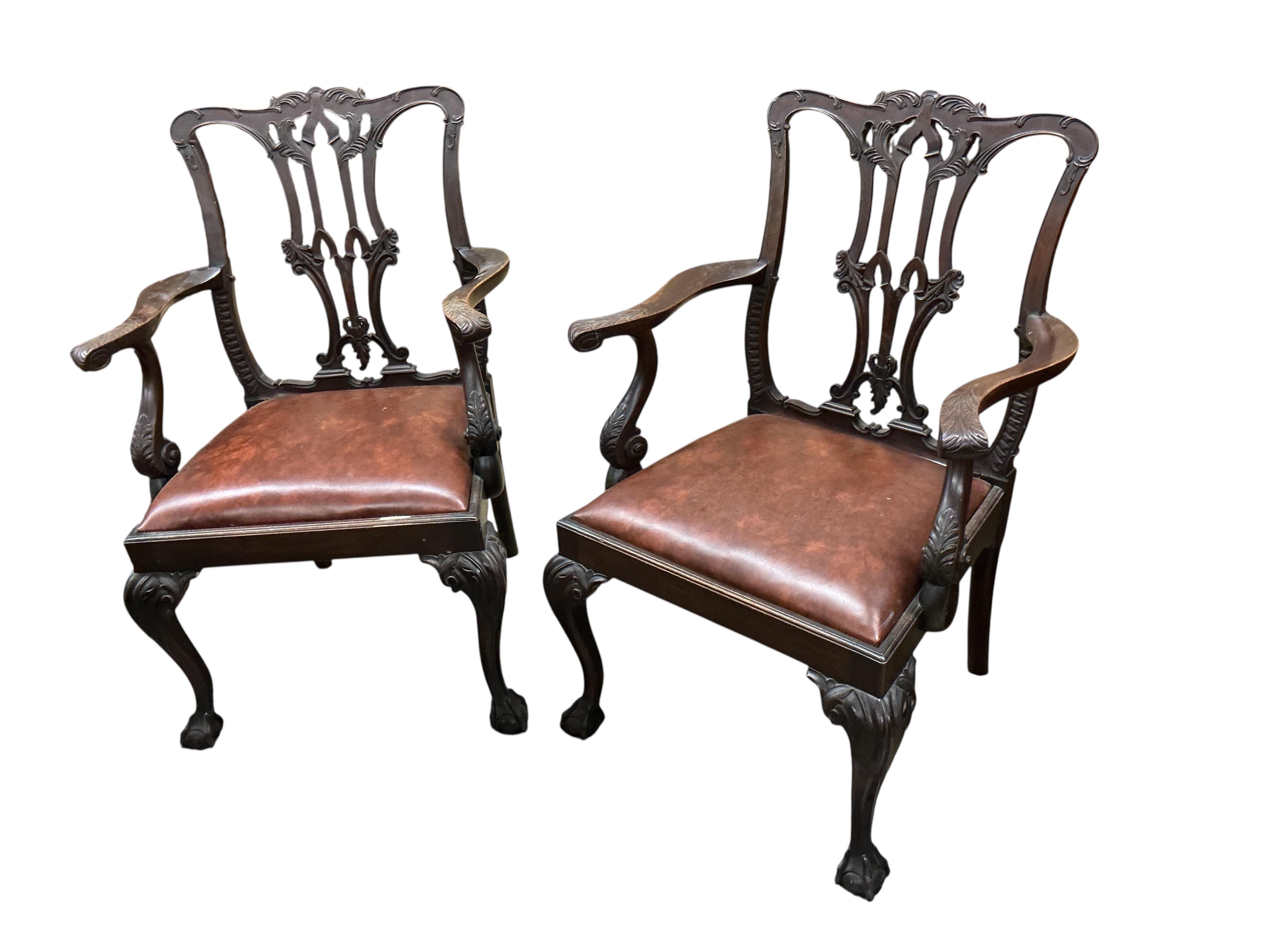 A set of six Chippendale Revival mahogany dining chairs, two with arms